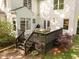 Wooden back deck featuring outdoor furniture and a grill, perfect for entertaining guests at 3612 Darwin Rd, Durham, NC 27707