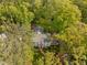 Aerial view showcasing a well-maintained exterior with manicured lawn and brick pathway at 3612 Darwin Rd, Durham, NC 27707