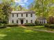 Classic two-story home with a well-manicured lawn and shrubbery, offering a traditional and inviting appearance at 3612 Darwin Rd, Durham, NC 27707