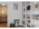Cozy living area with built-in shelves, a television, and an opening into an adjacent space at 3612 Darwin Rd, Durham, NC 27707