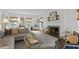 Elegant living room with a fireplace, comfortable seating, and stylish decor, perfect for relaxation and entertaining at 3612 Darwin Rd, Durham, NC 27707