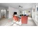 Large living room features a ceiling fan, recessed lighting, carpeted floors, and wooded views at 3612 Darwin Rd, Durham, NC 27707