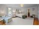 Bright primary bedroom with a king bed, sitting area, hardwood floors, and abundant natural light at 3612 Darwin Rd, Durham, NC 27707
