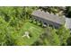 Aerial view of a green backyard with mature trees and bushes provides a peaceful outdoor space at 3667 Durwood Ln, Raleigh, NC 27604
