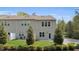 A backyard with a patio, green grass, and manicured trees and bushes creates a peaceful outdoor space at 3667 Durwood Ln, Raleigh, NC 27604
