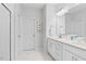 Bright bathroom with double vanity, framed art, and marble floors at 3667 Durwood Ln, Raleigh, NC 27604