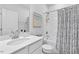 Bathroom featuring a bathtub with shower and decorative shower curtain at 3667 Durwood Ln, Raleigh, NC 27604
