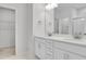 Bright bathroom with double vanity and large mirror at 3667 Durwood Ln, Raleigh, NC 27604