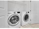 Bright laundry room with newer, front-load washer and dryer at 3667 Durwood Ln, Raleigh, NC 27604
