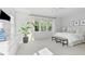 Bright and airy main bedroom with large windows, white bedding, and elegant decor at 3667 Durwood Ln, Raleigh, NC 27604