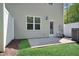 A concrete patio with a white fence offers a private outdoor area at 3667 Durwood Ln, Raleigh, NC 27604