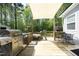 Expansive wooden deck includes a grill, shade covering, dining table, and hanging flower baskets at 38 Maple Cir, Pittsboro, NC 27312