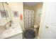 Cozy bathroom featuring a patterned shower curtain, vanity with sink and an integrated mirror at 38 Maple Cir, Pittsboro, NC 27312