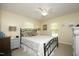 Calm bedroom with a metal frame bed, neutral bedding, and bedside lamps for a serene feel at 38 Maple Cir, Pittsboro, NC 27312