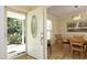 Welcoming foyer leading to dining area with stylish decor and modern lighting fixtures at 38 Maple Cir, Pittsboro, NC 27312