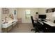 Functional home office with dual work stations and ample lighting for productivity at 38 Maple Cir, Pittsboro, NC 27312