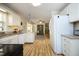 Bright kitchen with modern appliances, white cabinetry, and sleek countertops at 38 Maple Cir, Pittsboro, NC 27312