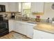 Classic kitchen featuring granite countertops, white cabinets and stainless steel dishwasher at 38 Maple Cir, Pittsboro, NC 27312