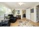 Cozy living room with natural light, plush seating, and access to another room at 38 Maple Cir, Pittsboro, NC 27312