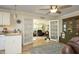 Open-concept living area with views into the dining room through french doors and into the kitchen at 38 Maple Cir, Pittsboro, NC 27312