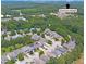Aerial view showcasing homes surrounded by trees, with a marker pointing towards Downtown Raleigh at 3811 Yates Mill Trail, Raleigh, NC 27606