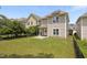 The backyard features a well-maintained lawn and a partial fence at 3811 Yates Mill Trail, Raleigh, NC 27606