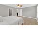Well-lit carpeted bedroom featuring views into the ensuite bath and walk-in closet at 3811 Yates Mill Trail, Raleigh, NC 27606