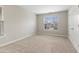 Empty bedroom has neutral carpet, a window, and a double door closet at 3811 Yates Mill Trail, Raleigh, NC 27606