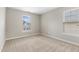 Neutral bedroom with carpet and two windows that let in natural light at 3811 Yates Mill Trail, Raleigh, NC 27606