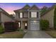 Charming two-story home with brick and siding, featuring a driveway and well-maintained landscaping at 3811 Yates Mill Trail, Raleigh, NC 27606