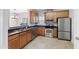 Efficient kitchen with stainless steel appliances and ample counter space at 3811 Yates Mill Trail, Raleigh, NC 27606