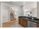 Kitchen featuring stainless steel appliances, dark countertops, and view into the living room at 3811 Yates Mill Trail, Raleigh, NC 27606