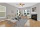 Cozy living room with hardwood floors, neutral decor and fireplace at 3811 Yates Mill Trail, Raleigh, NC 27606