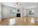 Bright living room features a fireplace, hardwood floors, and natural light at 3811 Yates Mill Trail, Raleigh, NC 27606