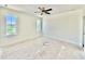 Bright bedroom with two windows featuring a ceiling fan and trim detail at 3817 Coach Lantern Ave, Wake Forest, NC 27587