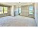 Bedroom featuring three large windows and bright lighting at 3817 Coach Lantern Ave, Wake Forest, NC 27587