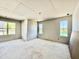 Bright bedroom under construction with three large windows, offering natural light and views of the surrounding neighborhood at 3817 Coach Lantern Ave, Wake Forest, NC 27587
