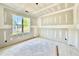 Unfinished bedroom featuring a window with views, drywall, and natural light flooding the space at 3817 Coach Lantern Ave, Wake Forest, NC 27587