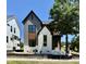 Beautiful new construction featuring a blend of gray siding and white brick, accented by modern black trim at 3817 Coach Lantern Ave, Wake Forest, NC 27587