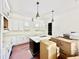 Kitchen featuring white cabinetry, a central island with marble countertops, and pendant lighting at 3817 Coach Lantern Ave, Wake Forest, NC 27587
