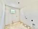 A laundry room during construction featuring a window and hookups, awaiting appliances and finishing touches for convenience at 3817 Coach Lantern Ave, Wake Forest, NC 27587