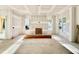Expansive living room showing great natural light from the outdoor living space and windows ready to be finished at 3817 Coach Lantern Ave, Wake Forest, NC 27587