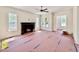 Bright and airy living room with fireplace and multiple windows ready for its new owners at 3817 Coach Lantern Ave, Wake Forest, NC 27587