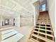 Spacious living room featuring unfinished stairs, bright lighting, and a versatile open floor plan at 3817 Coach Lantern Ave, Wake Forest, NC 27587