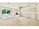 Open concept living room area with lots of natural light that leads to the outdoor living space through sliding glass doors at 3817 Coach Lantern Ave, Wake Forest, NC 27587