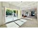 Open concept living room area with lots of natural light that leads to the outdoor living space through sliding glass doors at 3817 Coach Lantern Ave, Wake Forest, NC 27587