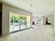 Expansive living space with sliding glass doors, fireplace, and large windows for abundant natural light at 3817 Coach Lantern Ave, Wake Forest, NC 27587