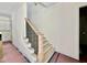 Staircase with wood treads and black iron railings at 3817 Coach Lantern Ave, Wake Forest, NC 27587