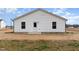 Rear exterior showcasing siding, windows, door, and an expansive yard at 385 Dasu Dr, Clayton, NC 27520