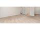 Spacious bedroom with plush carpeting and an ensuite bathroom for added privacy at 385 Dasu Dr, Clayton, NC 27520